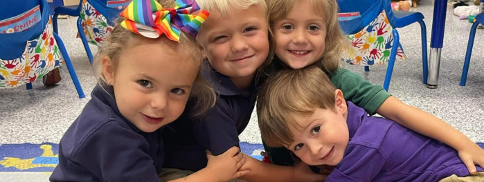 kids hugging while having a photo